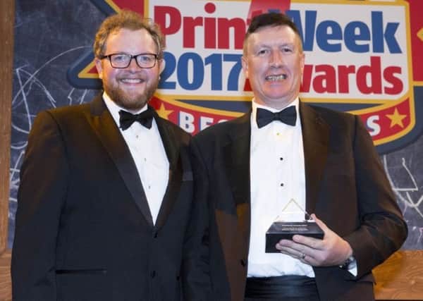 Ken Calderwood (right) receives the  Newspaper Printer of the Year 2017 award from comedian Miles Jupp. EMN-170211-121954001