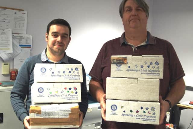 Reporter James Silcocks and content editor John Fieldhouse  with just some of the boxes that you, our readers have filled for this years appeal.