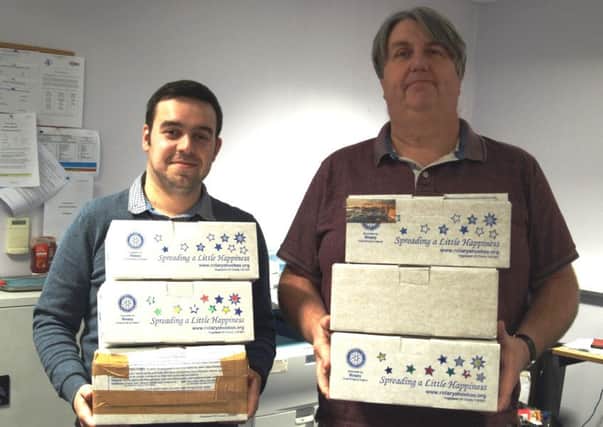Reporter James Silcocks and content editor John Fieldhouse  with just some of the boxes that you, our readers have filled for this years appeal.