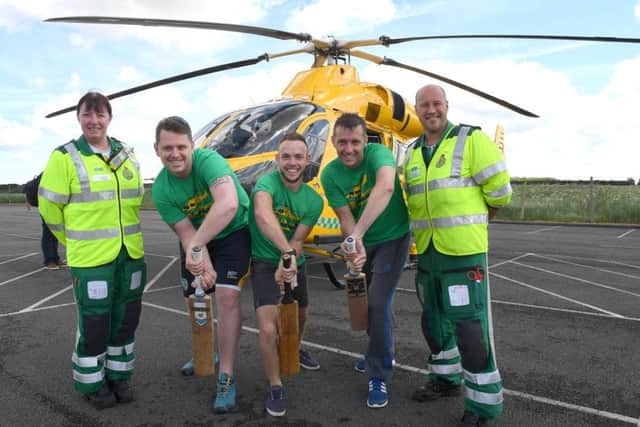 Shaun Brown, Richard Wells and Dave Newman who are going to attempt to break the record for longest indoor cricket net, raising money for Air Ambulance. L-R Jane Pattison - paramedic, Shaun, Richard, Dave, Neil Clarke - paramedic and ops manager. EMN-170611-175033002