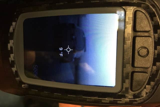 A police car as viewed through the handheld thermal camera. EMN-170711-164417001