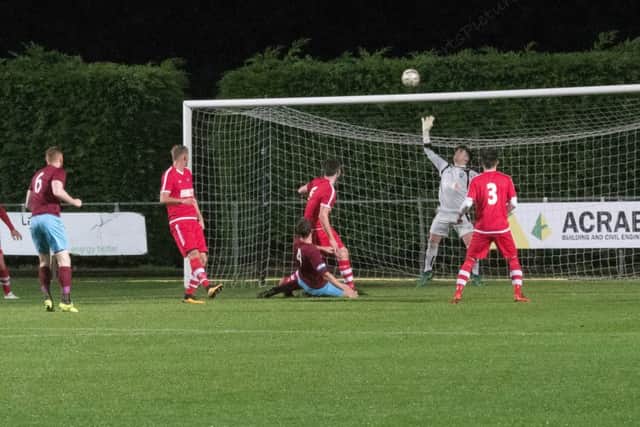 Keeper Harry Payne is tested.