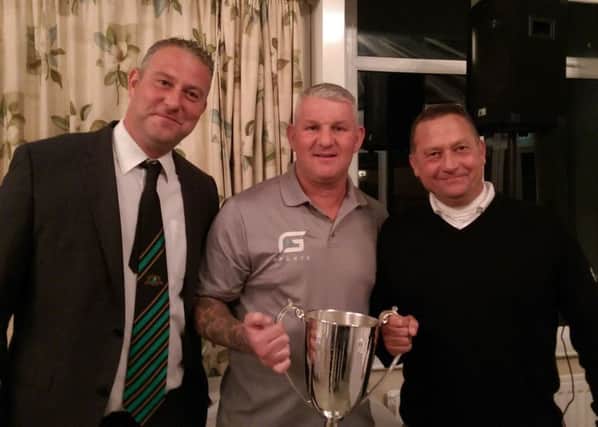 Windass, who played for Hull City, is pictured at the presentation with East Coast Caravans director Gareth Pinder and the day's winner local golfer Bret Linekar.
