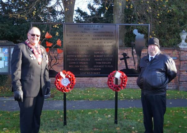The new memorial in Binbrook, with Ernie Thompson, RAOB wreath layer, and Ian Burgess, Parish Council wreath layer EMN-171211-202236001