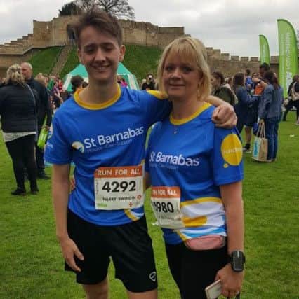 Carokline Swindin and her son Harry after running the Lincoln 10k - one of caroline's 35 for 35 challenges EMN-171120-114608001