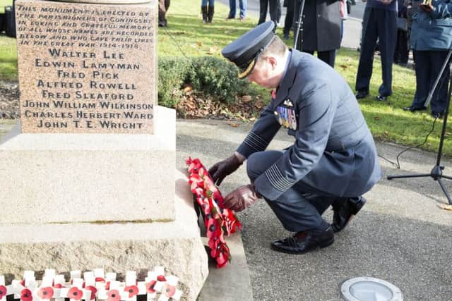 Gp Capt Baulkwill laying a wreath at Coningsby War Memorial. Picture: SAC Emma Wade RAF. EMN-171114-130300001