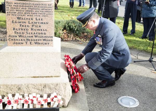 Gp Capt Baulkwill laying a wreath at Coningsby War Memorial. Picture: SAC Emma Wade RAF. EMN-171114-130300001