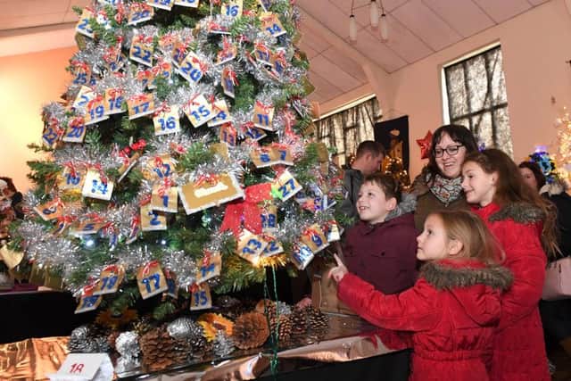 Last year's Christmas tree festival in Sleaford Methodist Church. Kelly Starbuck with Noah Starbuck 9, Florence Starbuck 5 and Evie-Sioux Starbuck 8. EMN-171114-160641001