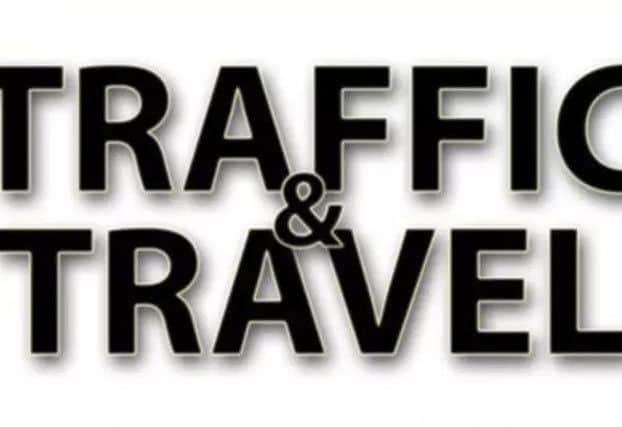 Temporary traffic lights are causing long delays.