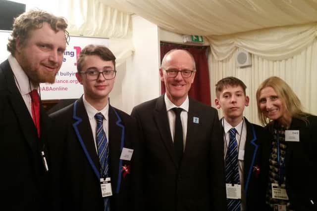 St George's Academy teacher Jamie Bennett (left) receiving his Power For Good award with, from left - Josh Young, Schools Minister Nick Gibb, Alex McCarthy and Head of Campus Claire Adams. EMN-171120-170120001