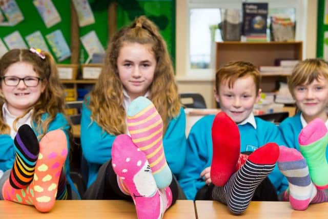 Theddlethorpe Academy's 'Odd Sock Day', featuring Emily Arnott (9), Lacey Martin (10), Royce Winters (9) and Lottie Hallam (8).