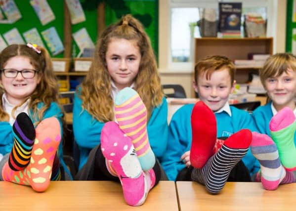 Theddlethorpe Academy's 'Odd Sock Day', featuring Emily Arnott (9), Lacey Martin (10), Royce Winters (9) and Lottie Hallam (8).