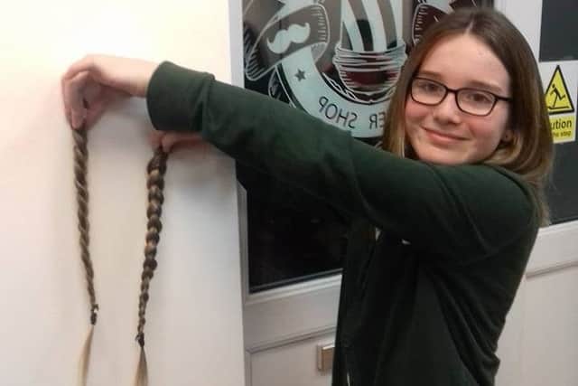 The plaits have gone... Xanthe Belll shows off her new style after having her hair cut for the Little Princess charity. ANL-171117-080002001