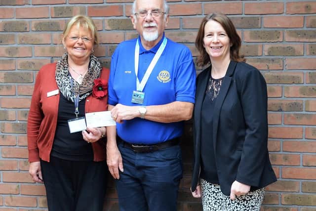 Peter Towle is pictured with Lindsey Lodge Fundraiser Anne Millett (left) and President of the Barrow Meridian Rotary Club Jayne Finnis (right).