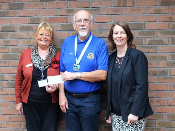 Peter Towle is pictured with Lindsey Lodge Fundraiser Anne Millett (left) and President of the Barrow Meridian Rotary Club Jayne Finnis (right).