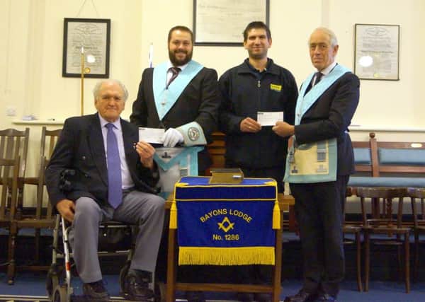 Worshipful Master of Bayons Lodge, Nathan Barnes, eft, and charity steward Edward Backus presented Â£750 to Mick Harper, chairman of the Lincolnshire Branch of the British Polio fellowship, and Richard Spence of LIVES EMN-171120-091227001