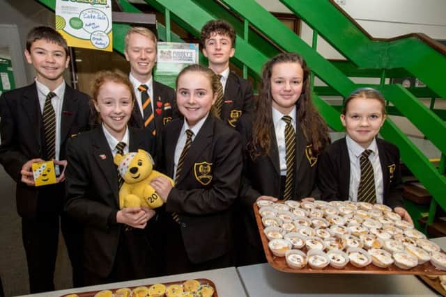 Smiles all round at cake sale for charity. Picture: John Aron. EMN-171120-111124001
