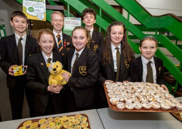 Smiles all round at cake sale for charity. Picture: John Aron. EMN-171120-111124001