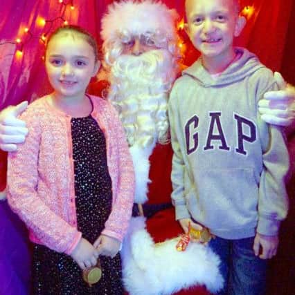 Hollie and Jack Robinson took the opportunity to visit Santa EMN-171120-152855001