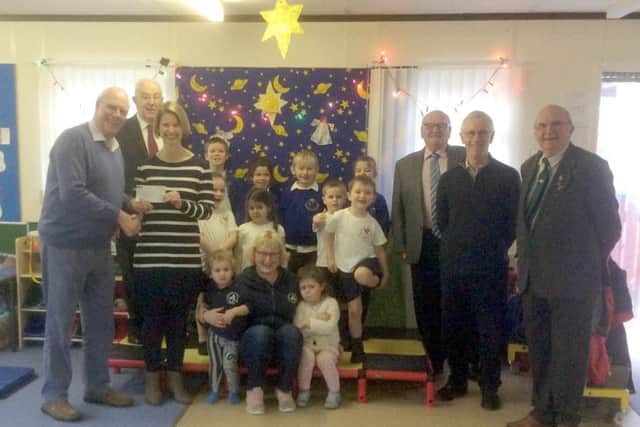 Bolingbroke Castle Masons of Horncastle presented ?750 to Tim Tin Nursery at Martin. EMN-171123-220913001
