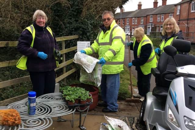 Sleaford In Bloom volunteers get busy planting bulbs beside the River Slea. EMN-171123-162516001