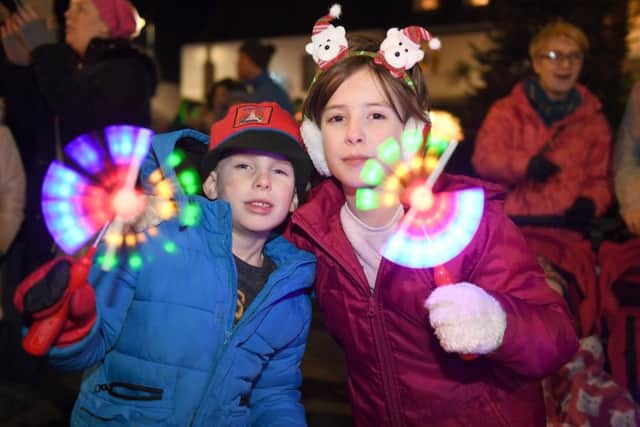 Finlay Howard. 6, and Mia Howard, 9, of Spilsby adding some light themselves to the town's Christmas market. Photo: MSKP-251117-51 ANL-171127-134021001