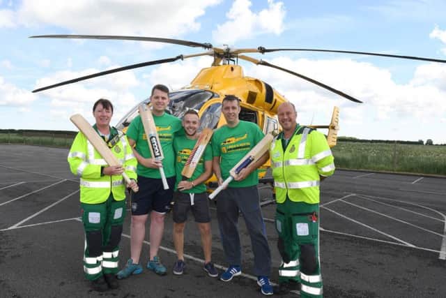 Shaun Brown, Richard Wells and Dave Newman who are going to attempt to break the record for longest indoor cricket net, raising money for Air Ambulance. From left - Jane Pattison - paramedic, Shaun, Richard, Dave, Neil Clarke - paramedic and ops manager. EMN-171122-181355001