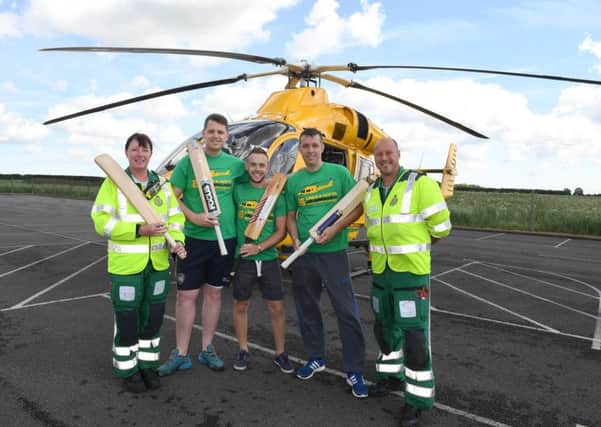 Shaun Brown, Richard Wells and Dave Newman who are going to attempt to break the record for longest indoor cricket net, raising money for Air Ambulance. From left - Jane Pattison - paramedic, Shaun, Richard, Dave, Neil Clarke - paramedic and ops manager. EMN-171122-181355001